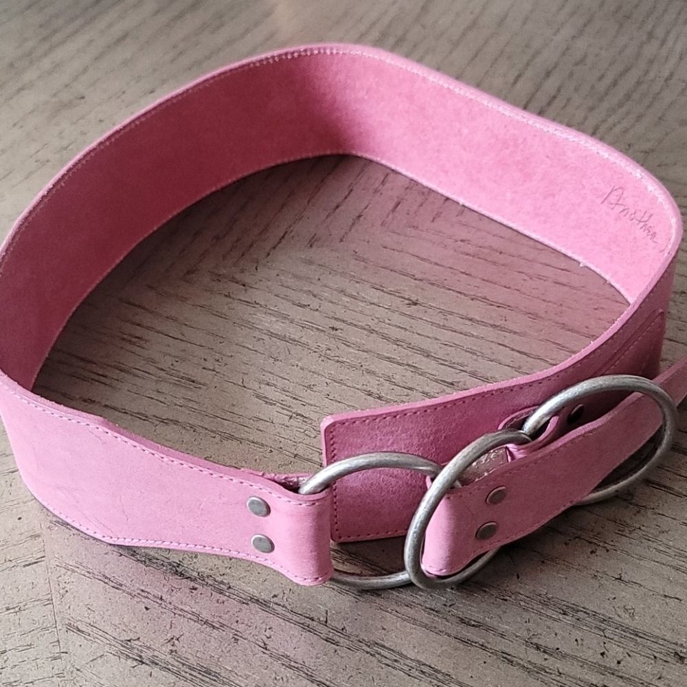 Pink adjustable belt fits sizes small to medium